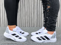 Tenis deportivos de líneas blanco para hombre